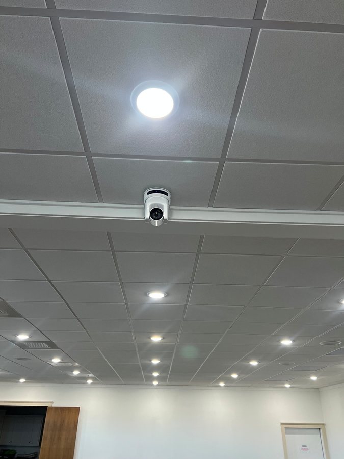 Ceiling mounted security camera in a commercial space