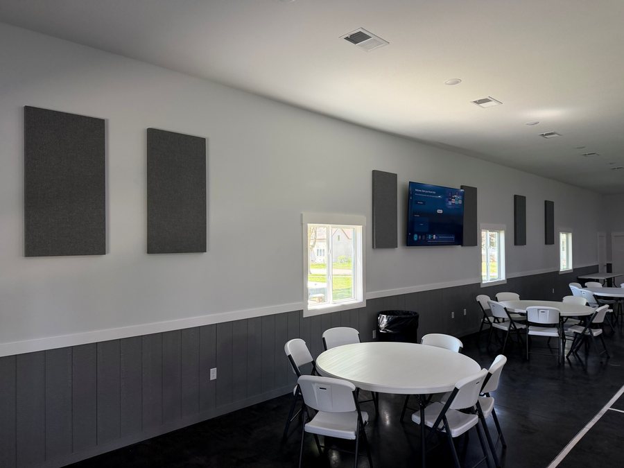 Event hall with wall displays and acoustic panels