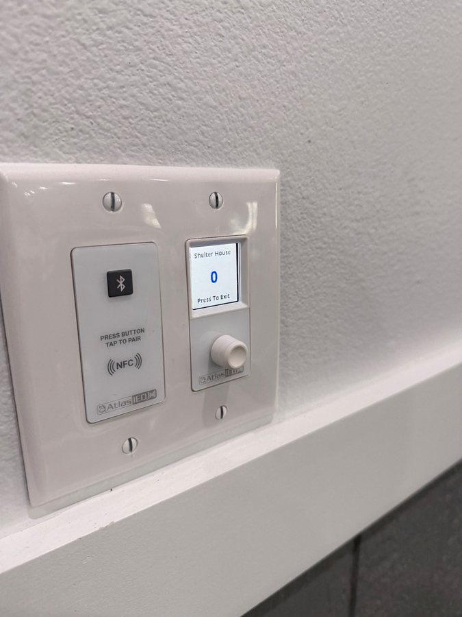 Wall control plates for a commercial audio system