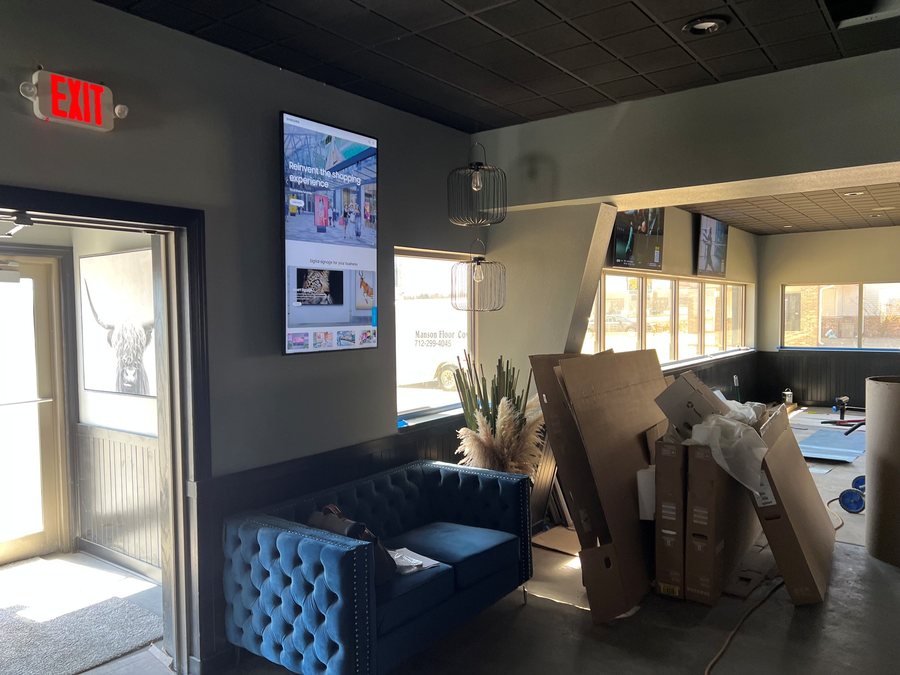Lounge with a vertical digital sign display